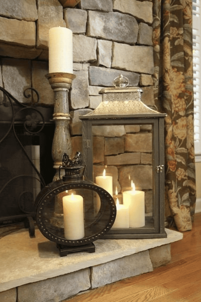 Decorate a fireplace with flameless candles, candle holders, lanterns