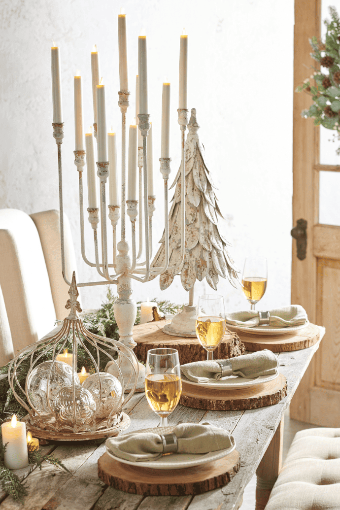Christmas centerpiece ideas with candles, greenery, candle hurricanes, French country candelabra, wood chargers