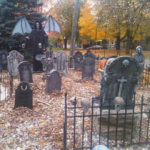 Scary ways to decorate your house for Halloween with a front yard graveyard display