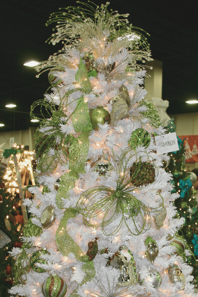 all white Christmas tree with green ornaments