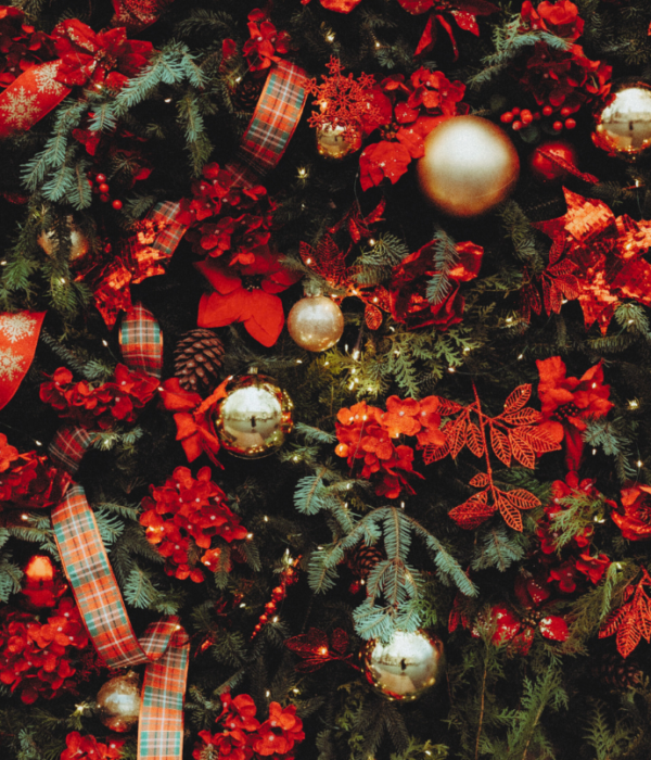 traditional Christmas tree with red florals, plaid ribbon