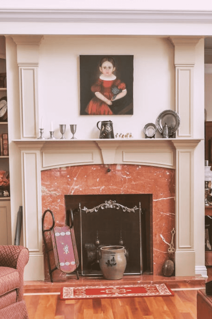 vase, logs in an an unusable fireplace