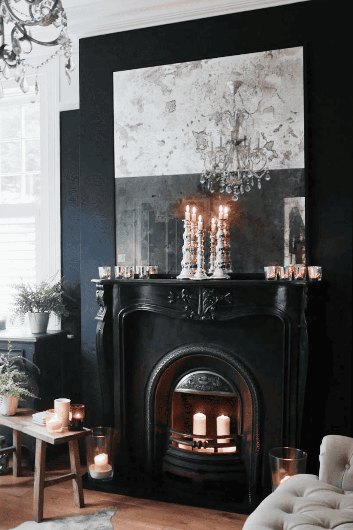 candles in a black, non working fireplace