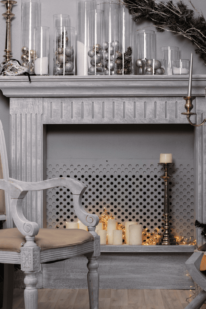 fairy lights, candles in an unused fireplace