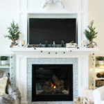 fireplace above mantel with small christmas decorations