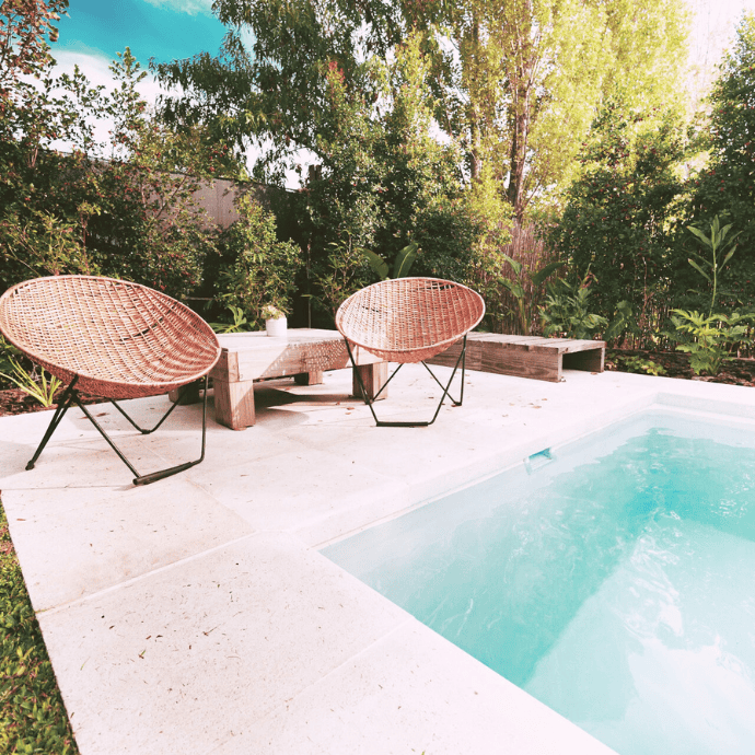 rattan chairs by small pool deck